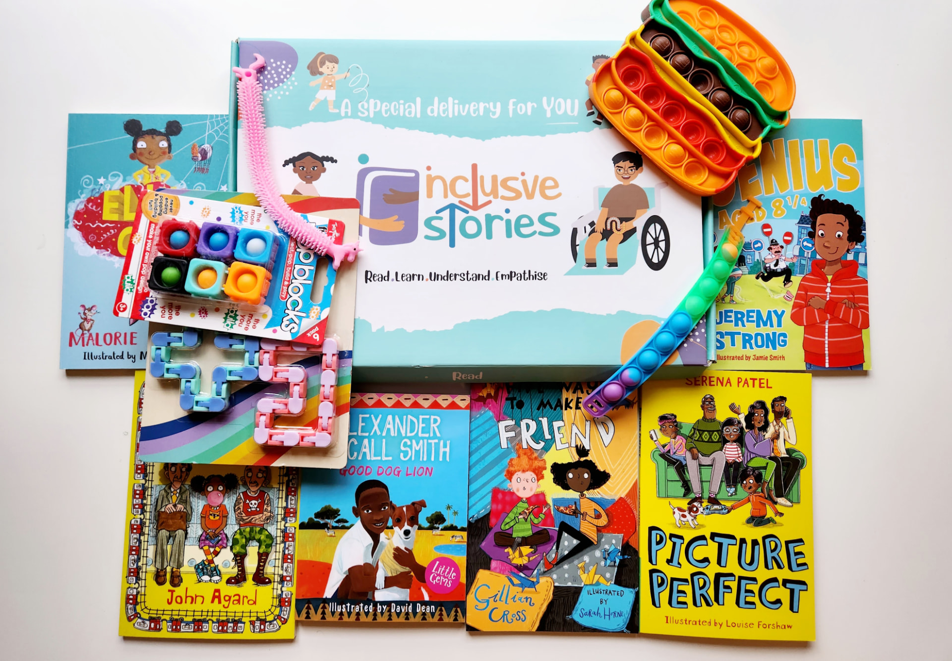 Inclusive Family subscription box with books for different ages and sensory toys